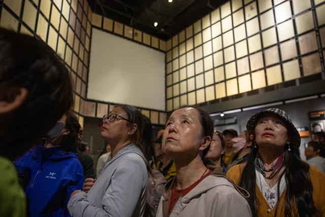 (250918) -- HARBIN, Sept. 18, 2025 (Xinhua) -- Visitors shed tears at the Exhibition Hall of Evidence of Crimes Committed by Unit 731 of the Japanese Imperial Army in Harbin, capital of northeast China's Heilongjiang Province, Sept. 18, 2025. "The real history is far more brutal than what the film can depict," said Jin Chengmin, curator of the Exhibition Hall of Evidence of Crime Committed by Unit 731 of the Japanese Imperial Army.
  Unit 731, a top-secret biological and chemical warfare research base, was established in the Pingfang District of Harbin, and served as the nerve center for Japanese biological warfare in China and Southeast Asia during World War II.
   Historical records suggest that between 1940 and 1945, at least 3,000 people were used in human experiments by Unit 731, while more than 300,000 people in China were killed by Japan's biological weapons. (Photo by Zhang Dawei/Xinhua)