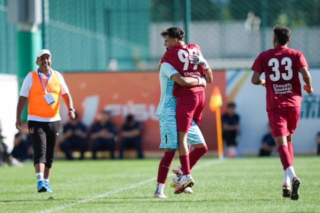 (250918) -- DALIAN, Sept. 18, 2025 (Xinhua) -- Kably Haitam of University Chouaib Doukkali (2nd R) celebrates with a teammate after scoring during the Men's Group D match between University Chouaib Doukkali (MAR) and Yanbian University (CHN) at 2025 FISU University World Cup Football in Dalian, northeast China's Liaoning Province, on Sept. 18, 2025. (Xinhua/Zheng Huansong)