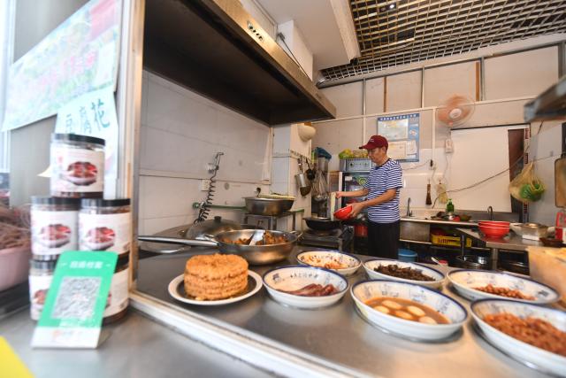 (250918) -- NANNING, Sept. 18, 2025 (Xinhua) -- A staff member cooks Luosifen at a restaurant in Liuzhou, south China's Guangxi Zhuang Autonomous Region, Sept. 14, 2025. Luosifen, or river snail rice noodles, drew attention and popularity at the ongoing 22nd China-ASEAN Expo.
  Known for its pungent smell, Luosifen is an iconic delicacy in Liuzhou. It features rice vermicelli soaked in a spicy broth nicely flavored by river snails and topped with ingredients such as pickled bamboo shoots, string beans, peanuts and fried tofu skin. In 2021, it was included in the fifth batch of China's national intangible cultural heritage list.
  Since 2015, the local government of Liuzhou has supported the modernization of Luosifen-related industries to achieve industrialization, standardization, branding and large-scale development of the industry. This signature street food has gained more recognition among overseas consumers ever since.
  In 2024, the total integrated industrial chain sales revenue of Luosifen exceeded 75 billion yuan (about 10.55 billion U.S. dollars) in Liuzhou. (Photo by Zheng Changhao/Xinhua)