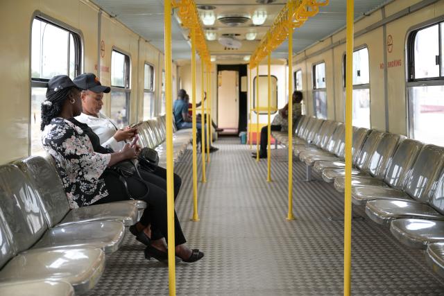 (250918) -- MOMBASA, Sept. 18, 2025 (Xinhua) -- People are pictured in a train carriage of the Mombasa commuter railway service at the Miritini SGR terminus in Mombasa, Kenya, on Sept. 17, 2025. Kenyan President William Ruto on Wednesday commissioned the Mombasa commuter railway service that will link downtown sections of the port city to a Standard Gauge Railway (SGR) terminus, which will ease the mobility of passengers and goods.
   TO GO WITH "Kenya commissions commuter rail service to ease mobility in port city of Mombasa" (Xinhua/Yang Guang)