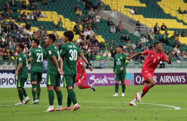 (250918) -- BEIJING, Sept. 18, 2025 (Xinhua) -- Vitao (1st R) of Cong An Ha Noi FC celebrates scoring during the Pool E match between Beijing Guoan of China and Cong An Ha Noi FC of Vietnam at the AFC Champions League Two in Beijing, capital of China, Sept. 18, 2025. (Xinhua/Hu Xingyu)