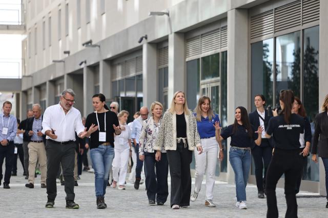 (250918) -- MILAN, Sept. 18, 2025 (Xinhua) -- IOC President Kirsty Coventry (C) visits the Milano Cortina 2026 Olympic and Paralympic Village in Milan, Italy, Sept. 18, 2025. (Xinhua/Li Jing)