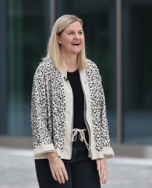 (250918) -- MILAN, Sept. 18, 2025 (Xinhua) -- IOC President Kirsty Coventry poses for a clip during her visit to the Milano Cortina 2026 Olympic and Paralympic Village in Milan, Italy, Sept. 18, 2025. (Xinhua/Li Jing)