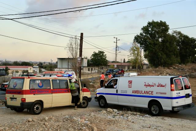 (250918) -- KFAR TEBNIT (LEBANON), Sept. 18, 2025 (Xinhua) -- Photo taken on Sept. 18, 2025, shows rescue workers arriving at the scene after an Israeli airstrike in the center of Kfar Tebnit, near Nabatieh in southern Lebanon. The Israeli army carried out several airstrikes Thursday evening across southern Lebanon, targeting villages including Mays el Jabal, Dibbine, and Kfar Tebnit, the National News Agency (NNA) reported. (Photo by Ali Hashisho/Xinhua)