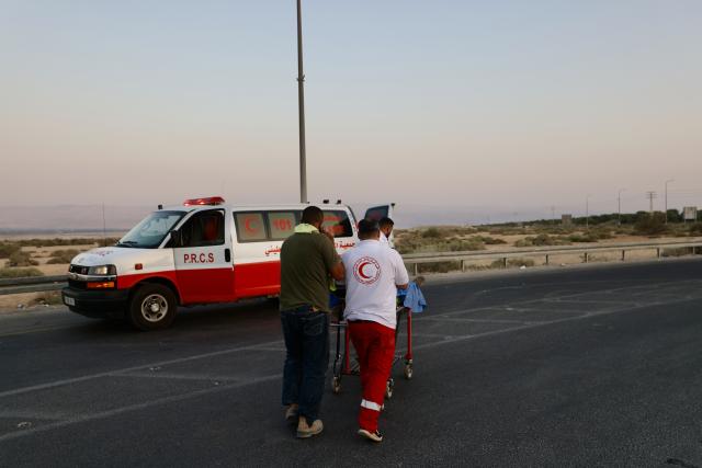 (250918) -- JERUSALEM, Sept. 18, 2025 (Xinhua) -- Emergency personnel work at the scene of an attack near the Allenby Bridge, Sept. 18, 2025. A gunman opened fire Thursday at the Allenby Bridge, a key crossing between the Israeli-occupied West Bank and Jordan, killing two Israelis before being shot dead, according to the Israel Defense Forces (IDF) and emergency service Magen David Adom (MDA). (Photo by Jamal Awad/Xinhua)