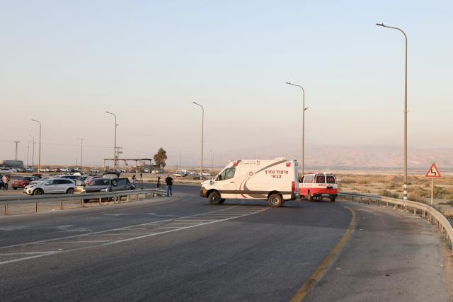 (250918) -- JERUSALEM, Sept. 18, 2025 (Xinhua) -- Emergency personnel work at the scene of an attack near the Allenby Bridge, Sept. 18, 2025. A gunman opened fire Thursday at the Allenby Bridge, a key crossing between the Israeli-occupied West Bank and Jordan, killing two Israelis before being shot dead, according to the Israel Defense Forces (IDF) and emergency service Magen David Adom (MDA). (Photo by Jamal Awad/Xinhua)
