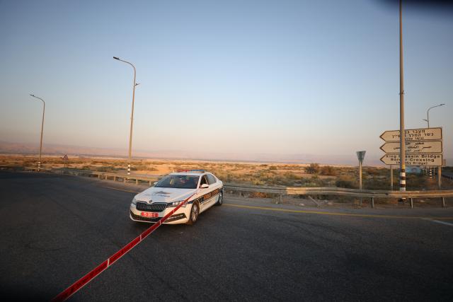 (250918) -- JERUSALEM, Sept. 18, 2025 (Xinhua) -- Police cordon off the scene of an attack near the Allenby Bridge, Sept. 18, 2025. A gunman opened fire Thursday at the Allenby Bridge, a key crossing between the Israeli-occupied West Bank and Jordan, killing two Israelis before being shot dead, according to the Israel Defense Forces (IDF) and emergency service Magen David Adom (MDA). (Photo by Jamal Awad/Xinhua)