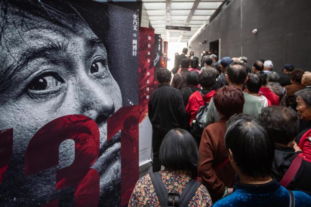 (250919) -- BEIJING, Sept. 19, 2025 (Xinhua) -- People walk past a poster of the film "Evil Unbound" at the Exhibition Hall of Evidence of Crimes Committed by Unit 731 of the Japanese Imperial Army in Harbin, capital of northeast China's Heilongjiang Province, Sept. 18, 2025.
  "The real history is far more brutal than what the film can depict," said Jin Chengmin, curator of the Exhibition Hall of Evidence of Crime Committed by Unit 731 of the Japanese Imperial Army.
  Unit 731, a top-secret biological and chemical warfare research base, was established in the Pingfang District of Harbin, and served as the nerve center for Japanese biological warfare in China and Southeast Asia during World War II.
  Historical records suggest that between 1940 and 1945, at least 3,000 people were used in human experiments by Unit 731, while more than 300,000 people in China were killed by Japan's biological weapons. (Photo by Zhang Dawei/Xinhua)