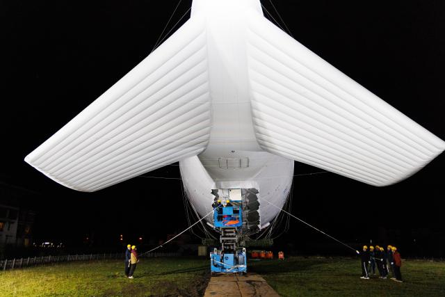 (250920) -- NYINGCHI, Sept. 20, 2025 (Xinhua) -- Technicians adjust the observation payloads during the "Jimu-1" tethered balloon atmospheric observation experiment in Lulang, Nyingchi, southwest China's Xizang Autonomous Region, Sept. 18, 2025.
  Chinese scientists recently carried out the "Jimu-1" tethered balloon atmospheric observation experiment in Lulang, Nyingchi, southwest China's Xizang Autonomous Region, which is expected to provide a new perspective for unraveling the mysteries of the Qinghai-Tibet Plateau ecosystem.
  The tethered balloon was equipped with 16 types of scientific payloads with a total weight of approximately 200 kilograms. It successfully ascended to an altitude of 5,500 meters. Through coordinated multi-payload observations, the experiment achieved a technological leap from single-point sampling to three-dimensional monitoring, according to the Aerospace Information Research Institute (AIR) of the Chinese Academy of Sciences, the major developer of the tethered balloon. (Xinhua/Jin Liwang)