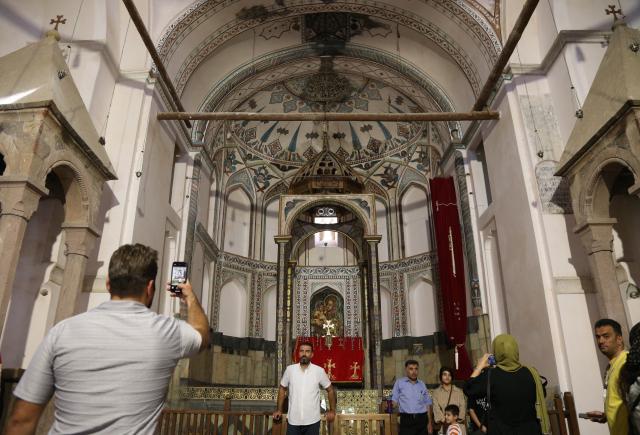(250921) -- JOLFA, Sept. 21, 2025 (Xinhua) -- People visit the Armenian Monastery of Saint Stepanos, 15 kilometres northwest of the city of Jolfa, Iran, on Sept. 18, 2025. (Xinhua/Shadati)