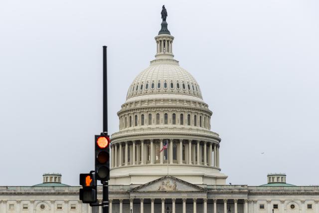 (250930) -- WASHINGTON, Sept. 30, 2025 (Xinhua) -- The U.S. Capitol building and traffic lights are seen in Washington D.C., the United States, Sept. 30, 2025. The federal government will shut down at 12:01 a.m. Wednesday unless the U.S. Congress approves a federal spending bill in the next few hours. (Xinhua/Hu Yousong)