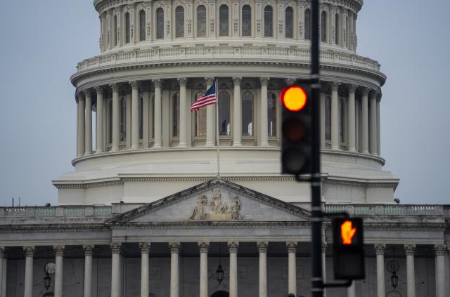 (250930) -- WASHINGTON, Sept. 30, 2025 (Xinhua) -- The U.S. Capitol building and traffic lights are seen in Washington D.C., the United States, Sept. 30, 2025. The federal government will shut down at 12:01 a.m. Wednesday unless the U.S. Congress approves a federal spending bill in the next few hours. (Xinhua/Hu Yousong)
