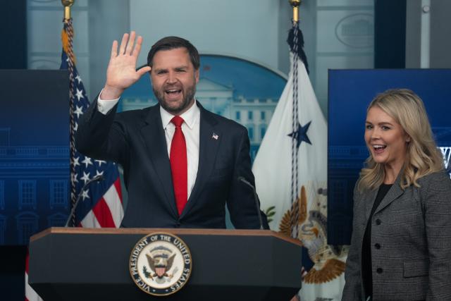 (251001) -- WASHINGTON, Oct. 1, 2025 (Xinhua) -- U.S. Vice President JD Vance (L) , standing with White House Press Secretary Karoline Leavitt, waves after speaking with reporters at the White House in Washington, D.C., the United States, Oct. 1, 2025. Vance warned on Wednesday that a prolonged federal government shutdown will lead to layoffs, blaming the Democrats for the current stalemate. (Xinhua/Hu Yousong)