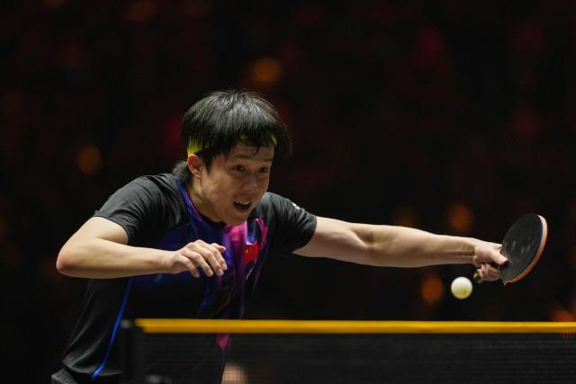 (251002) -- BEIJING, Oct. 2, 2025 (Xinhua) -- Wang Chuqin of China hits a return to An Jaehyun of South Korea during the men's singles round of 16 match at 2025 World Table Tennis (WTT) China Smash in Beijing, China, Oct. 2, 2025. (Xinhua/Ju Huanzong)