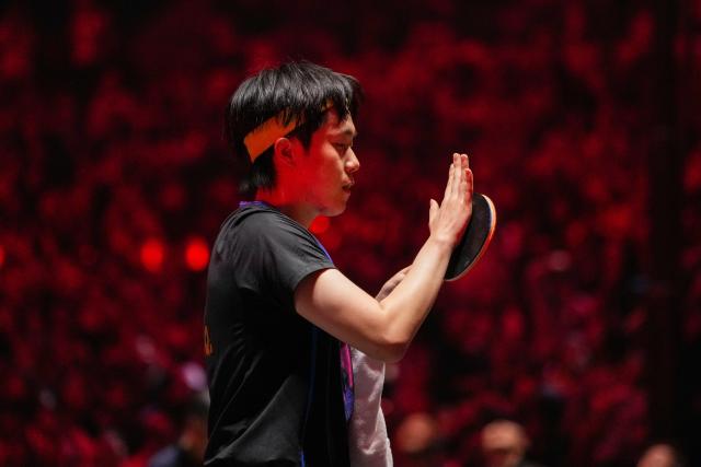 (251002) -- BEIJING, Oct. 2, 2025 (Xinhua) -- Wang Chuqin of China reacts while competing against An Jaehyun of South Korea during the men's singles round of 16 match at 2025 World Table Tennis (WTT) China Smash in Beijing, China, Oct. 2, 2025. (Xinhua/Ju Huanzong)