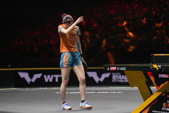 (251002) -- BEIJING, Oct. 2, 2025 (Xinhua) -- Hayata Hina of Japan reacts during the women's singles round of 16 match against Wang Manyu of China at 2025 World Table Tennis (WTT) China Smash in Beijing, China, Oct. 2, 2025. (Xinhua/Ju Huanzong)