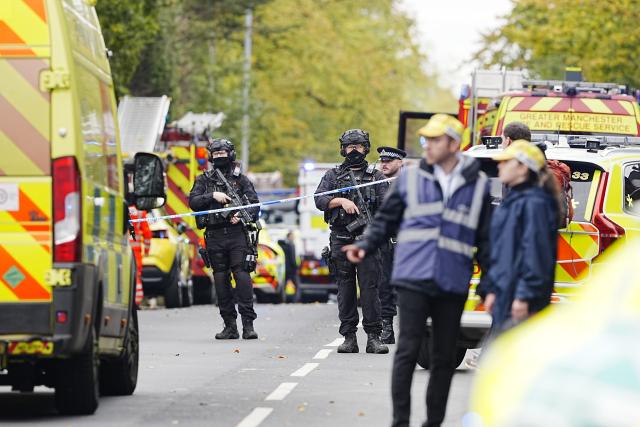 (251002) -- MANCHESTER(BRITAIN), Oct. 2, 2025 (Xinhua) -- Police officers and emergency services are pictured on the scene at Heaton Park Hebrew Congregation Synagogue in Manchester, Britain, Oct. 2, 2025. Police confirmed Thursday afternoon that the attack outside the Heaton Park Hebrew Congregation Synagogue on Middleton Road in Crumpsall, Manchester, has been declared a terrorist incident. (Xinhua)