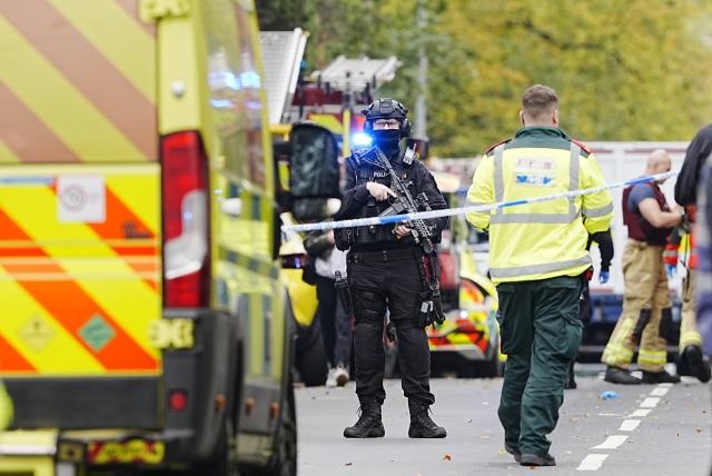 (251002) -- MANCHESTER(BRITAIN), Oct. 2, 2025 (Xinhua) -- Police officers and emergency services are pictured on the scene at Heaton Park Hebrew Congregation Synagogue in Manchester, Britain, Oct. 2, 2025. Police confirmed Thursday afternoon that the attack outside the Heaton Park Hebrew Congregation Synagogue on Middleton Road in Crumpsall, Manchester, has been declared a terrorist incident. (Xinhua)