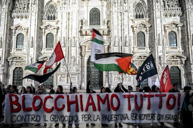 (251002) -- MILAN, Oct. 2, 2025 (Xinhua) -- Protesters gather for a demonstration in front of the Milan Cathedral, in Milan, Italy, Oct. 1, 2025. TO GO WITH "Roundup: European countries condemn Israeli interception of Gaza-bound flotilla, demand safety of citizens" (Str/Xinhua)