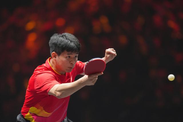 (251003) -- BEIJING, Oct. 3, 2025 (Xinhua) -- Lin Shidong hits a return during the men's singles quarterfinal match between Lin Shidong of China and Uda Yukiya of Japan at 2025 World Table Tennis (WTT) China Smash in Beijing, China, Oct. 3, 2025. (Xinhua/Ju Huanzong)