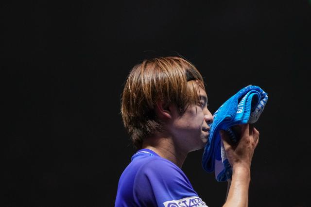 (251003) -- BEIJING, Oct. 3, 2025 (Xinhua) -- Uda Yukiya reacts during the men's singles quarterfinal match between Lin Shidong of China and Uda Yukiya of Japan at 2025 World Table Tennis (WTT) China Smash in Beijing, China, Oct. 3, 2025. (Xinhua/Ju Huanzong)