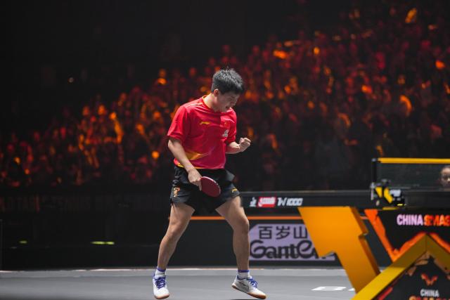 (251003) -- BEIJING, Oct. 3, 2025 (Xinhua) -- Lin Shidong celebrates scoring during the men's singles quarterfinal match between Lin Shidong of China and Uda Yukiya of Japan at 2025 World Table Tennis (WTT) China Smash in Beijing, China, Oct. 3, 2025. (Xinhua/Ju Huanzong)