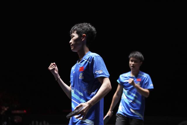 (251003) -- BEIJING, Oct. 3, 2025 (Xinhua) -- Zhou Qihao/Chen Junsong (L) react during the men's doubles semifinal match between Zhou Qihao/Chen Junsong of China and Matsushima Sora/Togami Shunsuke of Japan at 2025 World Table Tennis (WTT) China Smash in Beijing, China, Oct. 3, 2025. (Xinhua/Ju Huanzong)