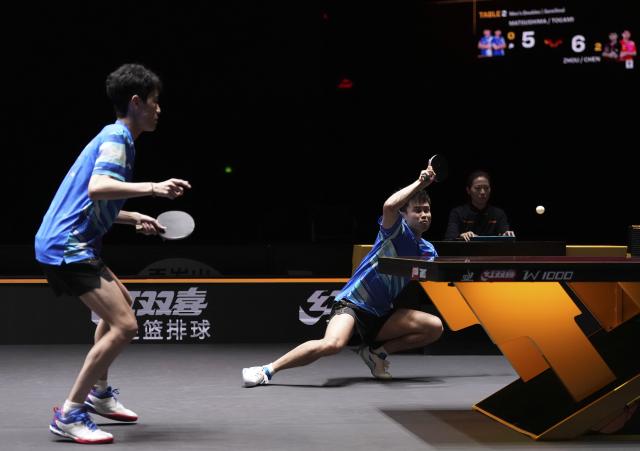 (251003) -- BEIJING, Oct. 3, 2025 (Xinhua) -- Zhou Qihao (R)/Chen Junsong compete during the men's doubles semifinal match between Zhou Qihao/Chen Junsong of China and Matsushima Sora/Togami Shunsuke of Japan at 2025 World Table Tennis (WTT) China Smash in Beijing, China, Oct. 3, 2025. (Xinhua/Ju Huanzong)