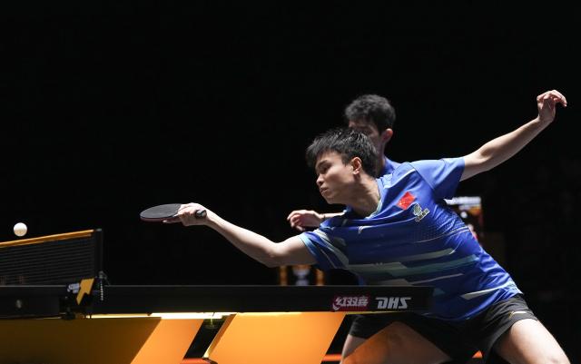 (251003) -- BEIJING, Oct. 3, 2025 (Xinhua) -- Zhou Qihao (front)/Chen Junsong compete during the men's doubles semifinal match between Zhou Qihao/Chen Junsong of China and Matsushima Sora/Togami Shunsuke of Japan at 2025 World Table Tennis (WTT) China Smash in Beijing, China, Oct. 3, 2025. (Xinhua/Ju Huanzong)