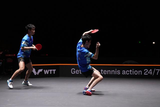 (251003) -- BEIJING, Oct. 3, 2025 (Xinhua) -- Zhou Qihao/Chen Junsong (R) compete during the men's doubles semifinal match between Zhou Qihao/Chen Junsong of China and Matsushima Sora/Togami Shunsuke of Japan at 2025 World Table Tennis (WTT) China Smash in Beijing, China, Oct. 3, 2025. (Xinhua/Ju Huanzong)