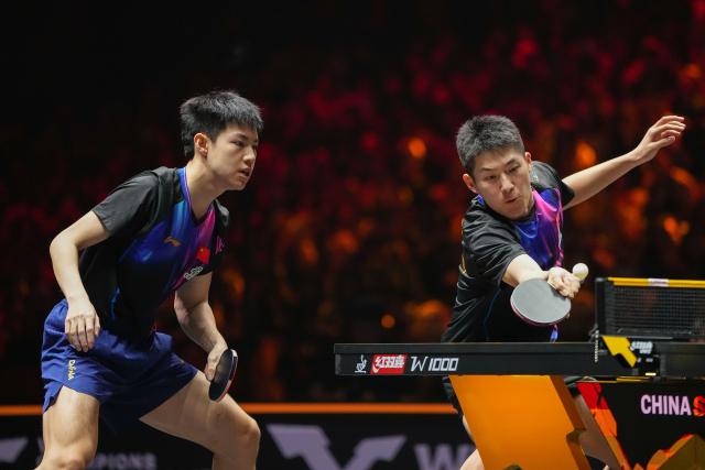 (251003) -- BEIJING, Oct. 3, 2025 (Xinhua) -- Huang Youzheng/Wen Ruibo (R) compete during the men's doubles semifinal match between Huang Youzheng/Wen Ruibo of China and Wang Chuqin/Lin Shidong of China at 2025 World Table Tennis (WTT) China Smash in Beijing, China, Oct. 3, 2025. (Xinhua/Ju Huanzong)