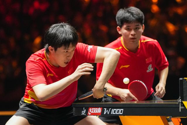 (251003) -- BEIJING, Oct. 3, 2025 (Xinhua) -- Wang Chuqin (L)/Lin Shidong compete during the men's doubles semifinal match between Huang Youzheng/Wen Ruibo of China and Wang Chuqin/Lin Shidong of China at 2025 World Table Tennis (WTT) China Smash in Beijing, China, Oct. 3, 2025. (Xinhua/Ju Huanzong)