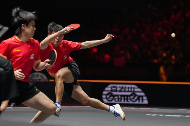 (251003) -- BEIJING, Oct. 3, 2025 (Xinhua) -- Wang Chuqin/Lin Shidong (R) compete during the men's doubles semifinal match between Huang Youzheng/Wen Ruibo of China and Wang Chuqin/Lin Shidong of China at 2025 World Table Tennis (WTT) China Smash in Beijing, China, Oct. 3, 2025. (Xinhua/Ju Huanzong)