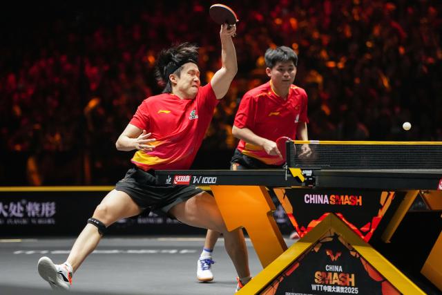 (251003) -- BEIJING, Oct. 3, 2025 (Xinhua) -- Wang Chuqin (L)/Lin Shidong compete during the men's doubles semifinal match between Huang Youzheng/Wen Ruibo of China and Wang Chuqin/Lin Shidong of China at 2025 World Table Tennis (WTT) China Smash in Beijing, China, Oct. 3, 2025. (Xinhua/Ju Huanzong)