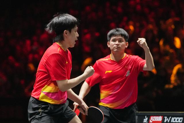 (251003) -- BEIJING, Oct. 3, 2025 (Xinhua) -- Wang Chuqin/Lin Shidong (R) celebrate scoring during the men's doubles semifinal match between Huang Youzheng/Wen Ruibo of China and Wang Chuqin/Lin Shidong of China at 2025 World Table Tennis (WTT) China Smash in Beijing, China, Oct. 3, 2025. (Xinhua/Ju Huanzong)