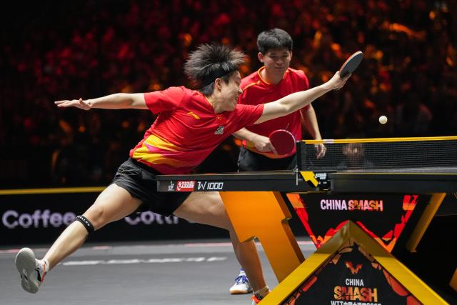 (251003) -- BEIJING, Oct. 3, 2025 (Xinhua) -- Wang Chuqin (L)/Lin Shidong compete during the men's doubles semifinal match between Huang Youzheng/Wen Ruibo of China and Wang Chuqin/Lin Shidong of China at 2025 World Table Tennis (WTT) China Smash in Beijing, China, Oct. 3, 2025. (Xinhua/Ju Huanzong)