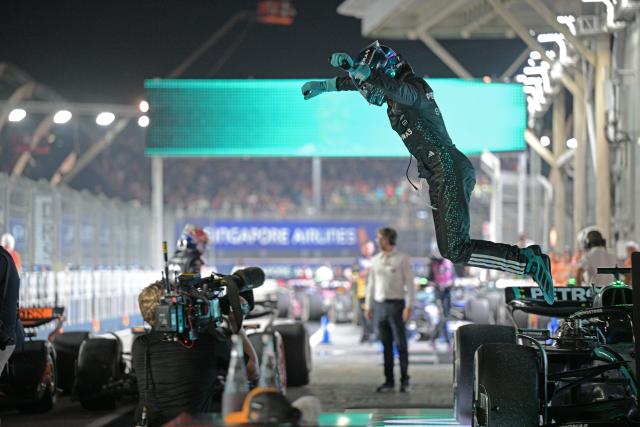 (251006) -- SINGAPORE, Oct. 6, 2025 (Xinhua) -- Mercedes' British driver George Russell celebrates after the Formula 1 Singapore Grand Prix 2025 in Singapore, Oct. 5, 2025. (Photo by Then Chih Wey/Xinhua)
