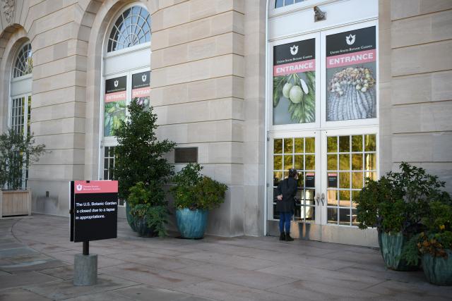 (251006) -- WASHINGTON, Oct. 6, 2025 (Xinhua) -- A woman looks into the United States Botanic Garden as a notice of closure is seen in front of its entrance in Washington, D.C., the United States, Oct. 5, 2025. As the U.S. federal government entered a shutdown -- the first time in nearly seven years -- the confrontation between President Donald Trump's administration and the Democratic Party has further escalated.
   The Trump administration has cut funding and programs in Democratic-led states and sought to dismantle federal agencies led by Democrats. Meanwhile, Democrats have shown a rare sense of unity, hoping to reverse declining approval ratings through the fight.
   This new round of partisan conflict over the government shutdown is markedly different from previous ones, characterized by greater hostility and malice that has pushed partisan strife to new heights. It highlights the deepening political polarization in the United States while inflicting greater harm on the American people. (Xinhua/Li Rui)