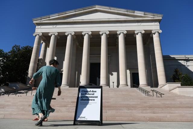 (251006) -- WASHINGTON, Oct. 6, 2025 (Xinhua) -- A woman walks past a notice of closure of the National Gallery of Art in Washington, D.C., the United States, Oct. 5, 2025. As the U.S. federal government entered a shutdown -- the first time in nearly seven years -- the confrontation between President Donald Trump's administration and the Democratic Party has further escalated.
   The Trump administration has cut funding and programs in Democratic-led states and sought to dismantle federal agencies led by Democrats. Meanwhile, Democrats have shown a rare sense of unity, hoping to reverse declining approval ratings through the fight.
   This new round of partisan conflict over the government shutdown is markedly different from previous ones, characterized by greater hostility and malice that has pushed partisan strife to new heights. It highlights the deepening political polarization in the United States while inflicting greater harm on the American people. (Xinhua/Li Rui)