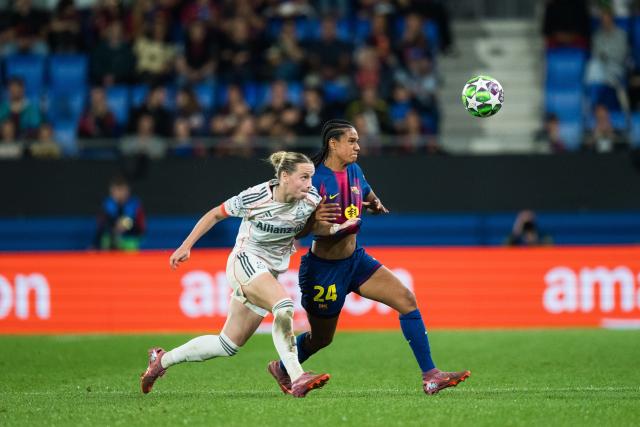 (251008) -- BARCELONA, Oct. 8, 2025 (Xinhua) -- Esmee Brugts (R) of Barcelona vies with Magdalena Eriksson of Bayern Munich during the league phase match between FC Barcelona and Bayern Munich at the UEFA Women's Champions League in Barcelona, Spain, Oct. 7, 2025. (Photo by Joan Gosa/Xinhua)