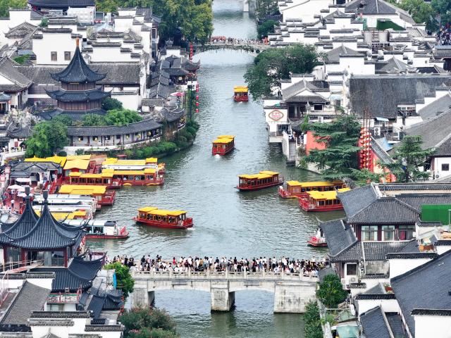 (251009) -- BEIJING, Oct. 9, 2025 (Xinhua) -- An aerial drone photo taken on Oct. 1, 2025 shows people visiting Confucius Temple scenic area in Nanjing, east China's Jiangsu Province. China recorded 888 million domestic tourist trips during the eight-day National Day and Mid-Autumn Festival holiday, up 123 million from the seven-day National Day holiday in 2024, the Ministry of Culture and Tourism said Thursday.
   Domestic tourism spending reached 809 billion yuan (about 113.8 billion U.S. dollars), up 108 billion yuan year on year, according to the ministry. (Photo by Liu Jianhua/Xinhua)