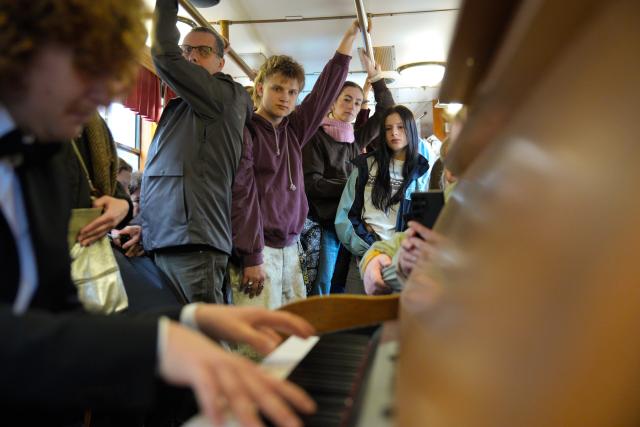 (251010) -- WARSAW, Oct. 10, 2025 (Xinhua) -- Passengers listen to a pianist playing works by Frederic Chopin aboard a "Chopin Tram" in Warsaw, Poland, Oct. 9, 2025. The "Chopin Tram" is a public cultural initiative launched in Warsaw during the International Fryderyk Chopin Piano Competition. Passengers can enjoy live performances of Chopin's music during the ride, turning the city's tram into a "moving concert hall."
   The 19th International Fryderyk Chopin Piano Competition is currently underway in Warsaw and will run until Oct. 23. (Photo by Jaap Arriens/Xinhua)