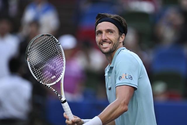 (251010) -- SHANGHAI, Oct. 10, 2025 (Xinhua) -- Arthur Rinderknech of France reacts after defeating Felix Auger-Aliassime of Canada in the men's singles quarterfinal at the ATP World Tour Shanghai Masters tennis tournament in Shanghai, east China, Oct. 10, 2025. (Xinhua/Chen Haoming)