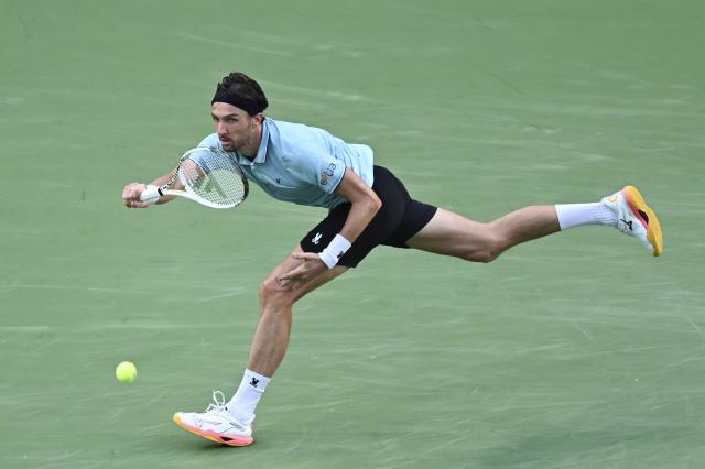 (251010) -- SHANGHAI, Oct. 10, 2025 (Xinhua) -- Arthur Rinderknech of France hits a return to Felix Auger-Aliassime of Canada during the men's singles quarterfinal at the ATP World Tour Shanghai Masters tennis tournament in Shanghai, east China, Oct. 10, 2025. (Xinhua/Chen Haoming)
