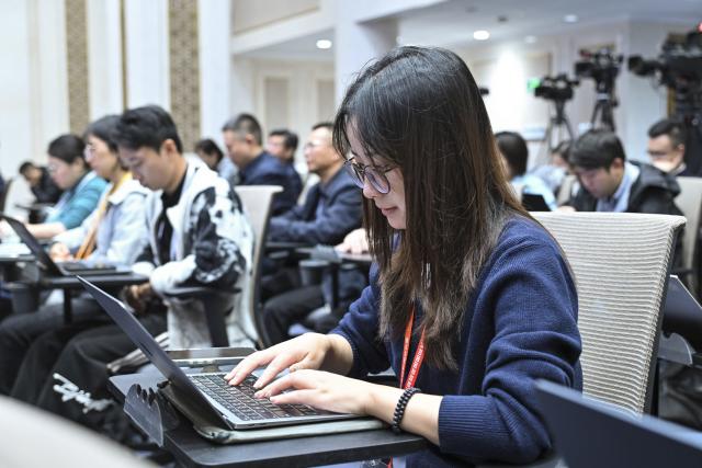 (251011) -- BEIJING, Oct. 11, 2025 (Xinhua) -- Journalists work at a press conference held by the State Council Information Office (SCIO) on achievements in high-quality housing and urban-rural development during the 14th Five-Year Plan period (2021-2025) in Beijing, capital of China, Oct. 11, 2025. (Xinhua/Li Xin)