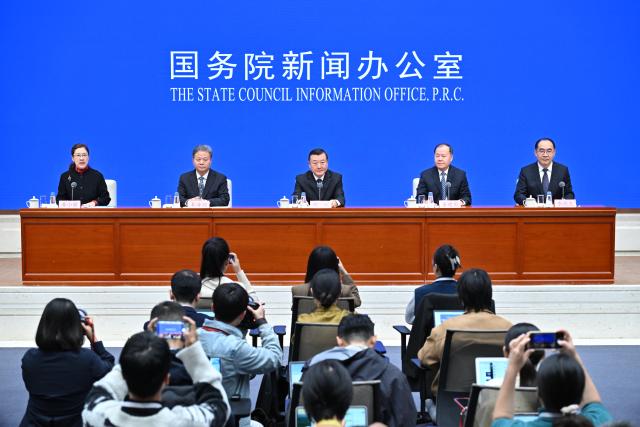 (251011) -- BEIJING, Oct. 11, 2025 (Xinhua) -- China's Minister of Housing and Urban-Rural Development Ni Hong (C) attends a press conference held by the State Council Information Office (SCIO) on achievements in high-quality housing and urban-rural development during the 14th Five-Year Plan period (2021-2025) in Beijing, capital of China, Oct. 11, 2025. (Xinhua/Li Xin)