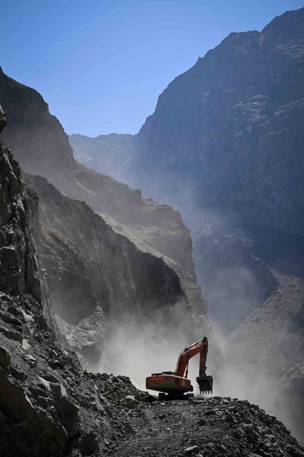 (251011) -- DUSHANBE, Oct. 11, 2025 (Xinhua) -- An excavator operates at the construction site of the second-phase section of the China-Tajikistan Highway near Kalai Khumb, Tajikistan, on Sept. 11, 2025. The China-Tajikistan Highway -- also known as the Pamir Highway -- was first built in the 1940s. Stretching more than 1,000 km from Dushanbe to Karasu on the China-Tajikistan border, it is vital for Tajikistan's transport and external links.
   TO GO WITH "Feature: China-Tajikistan Highway a lifeline on the Pamirs" (Xinhua/Li Renzi)