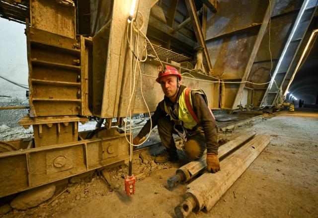 (251011) -- DUSHANBE, Oct. 11, 2025 (Xinhua) -- A worker operates at the construction site of the second-phase section of the China-Tajikistan Highway near Kalai Khumb, Tajikistan, on Sept. 11, 2025. The China-Tajikistan Highway -- also known as the Pamir Highway -- was first built in the 1940s. Stretching more than 1,000 km from Dushanbe to Karasu on the China-Tajikistan border, it is vital for Tajikistan's transport and external links.
   TO GO WITH "Feature: China-Tajikistan Highway a lifeline on the Pamirs" (Xinhua/Li Renzi)