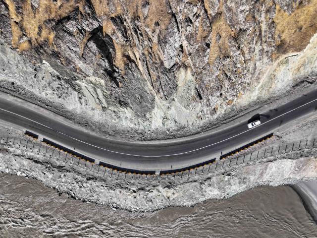 (251011) -- DUSHANBE, Oct. 11, 2025 (Xinhua) -- An aerial drone photo shows part of the second-phase section of the China-Tajikistan Highway near Kalai Khumb, Tajikistan, on Sept. 11, 2025. The China-Tajikistan Highway -- also known as the Pamir Highway -- was first built in the 1940s. Stretching more than 1,000 km from Dushanbe to Karasu on the China-Tajikistan border, it is vital for Tajikistan's transport and external links.
   TO GO WITH "Feature: China-Tajikistan Highway a lifeline on the Pamirs" (Xinhua/Li Renzi)