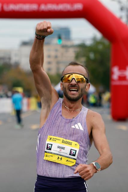 (251013) -- BUCHAREST, Oct. 13, 2025 (Xinhua) -- Romanian runner Nicolae Soare celebrates winning the Bucharest Marathon men's race in Bucharest, Romania, Oct. 12, 2025. (Photo by Cristian Cristel/Xinhua)